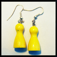 Image de boucles d'oreilles pions jaunes